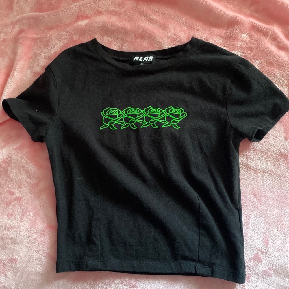 black cropped tee with neon green roses